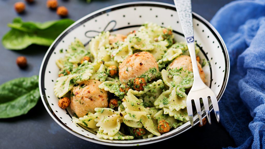 Spinach and Egg White Scramble cooking in a pan – a healthy breakfast idea for seniors.