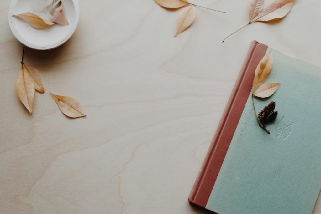A closed journal on a pale tabletop