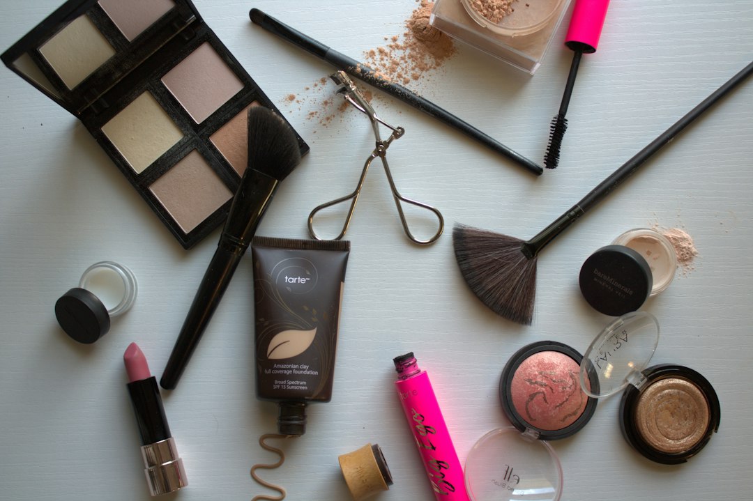 Eyeshadow, lipstick and makeup tools on a dressing table